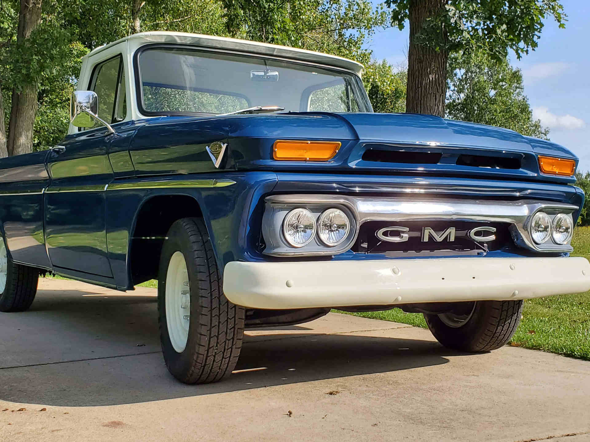 Front bumper view of a dark blue 1965 GMC C1500